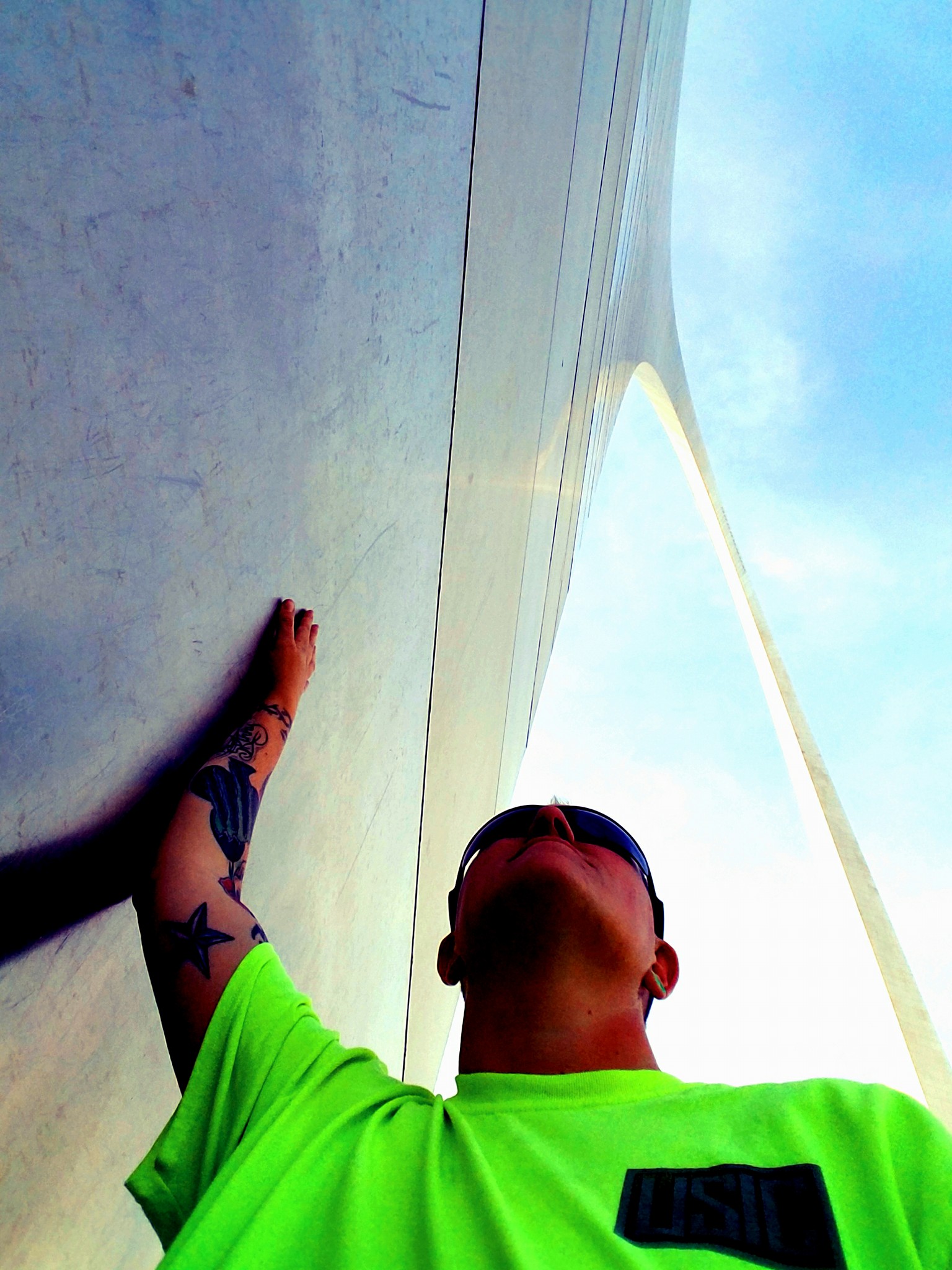 Man looking up at building